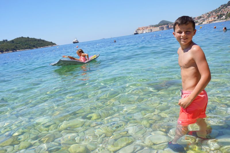 Sveti Jakov beach with Dubrovnik Old Town in the distance